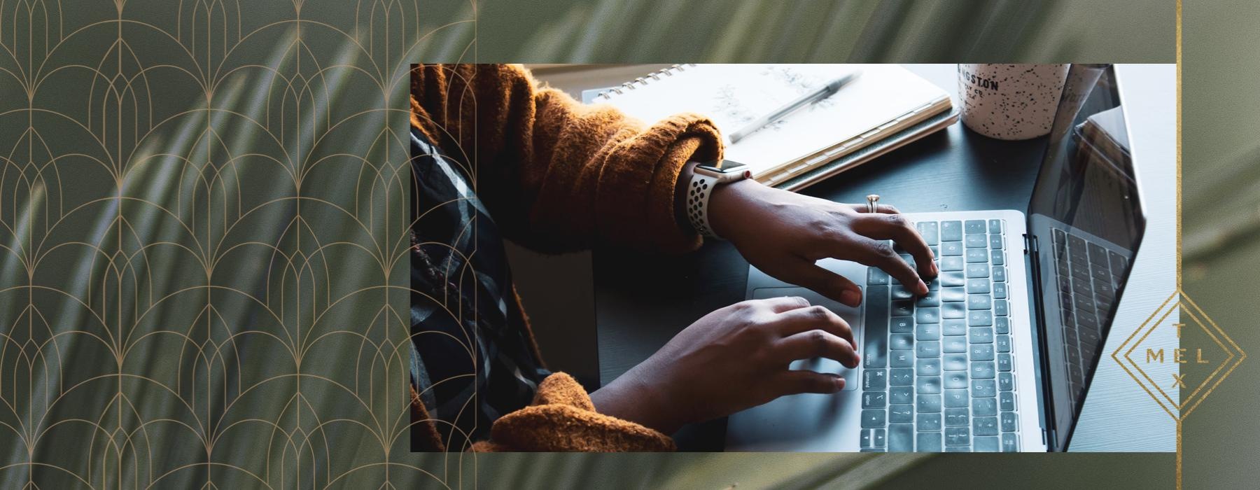 a person typing on a laptop