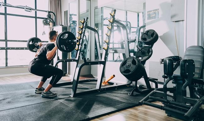 Quick access to state-of-the-art amenities a person working out in a gym